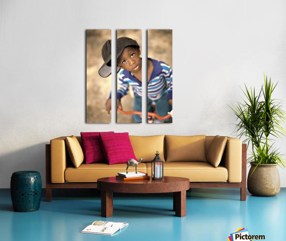 boy wearing over sized hat riding bike pacificstock canvas