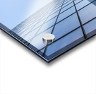 Blue curved glass skyscraper facade against sky Acrylic print
