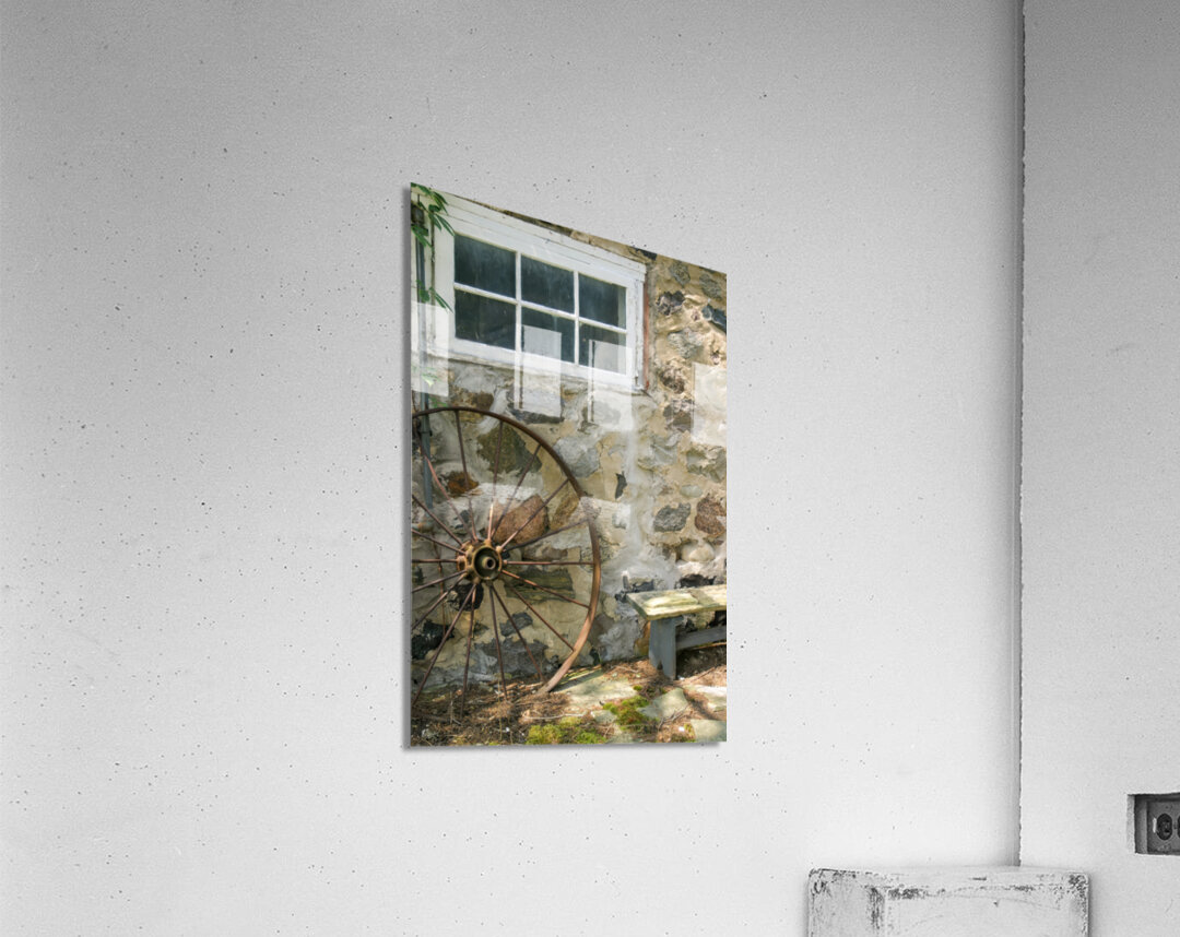 Rusty Wheel and Stone Wall Acrylic Print