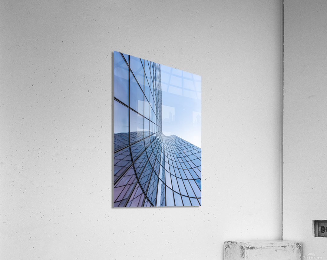 Blue curved glass skyscraper facade against sky Acrylic Print