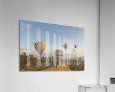 hot air balloon flies low over the city of goreme  Acrylic Print