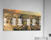 hot air balloon flies low over the city of goreme Acrylic Print