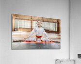 Young girl practicing karate split in dojo Acrylic Print