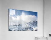 Clouds over mountain range in the European Alps in winter  Acrylic Print