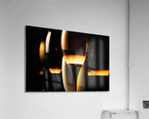 Dark wine glasses in an orange light close up view Acrylic Print
