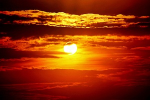 Sunset Embrace: A Couple Silhouetted Against a Fiery Sky