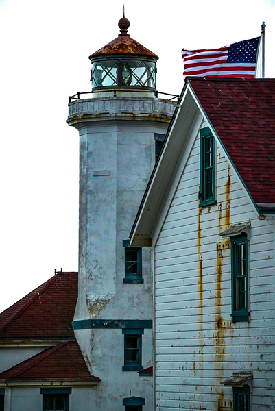 Lighthouse With Flag by Anthony Cummins