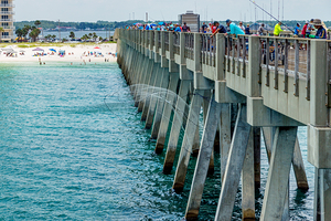 Throwing The Fishing Net Over The Pier