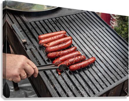 Frying sausages Canvas Print