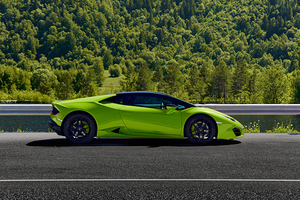 The green Lamborghini Huracan parked in the mountains 