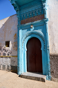 A striking blue door stands out on a sunny day in Al-Jadida Morocco