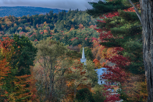 Church steeple above autumns fall colors
