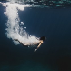 Woman diving underwater