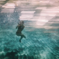 Woman diving underwater for snorkeling