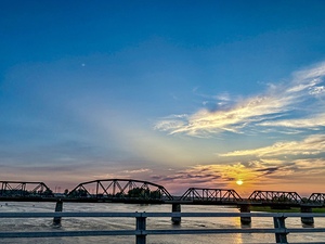 Sunset on a railway bridge by Genevieve Gagnon