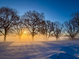Sunrise behind the sea smoke 1 by Genevieve Gagnon