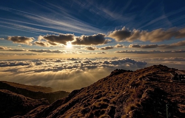 Golden Peaks: Sunset Over the Cloud Sea by ahmed zayed