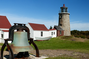 Old Fog Bell by Stone Tower of Monhegan Island Lighthouse in Midcoast Maine