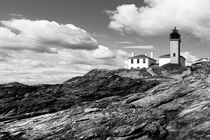 Beavertail Lighthouse Over Jagged Rocks Outside of Newport Rhode Island - B&W