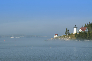 Fishing Boat Passes Burnt Coat Harbor Light in the Fog in Maine