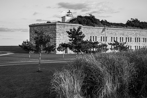 Clarks Point Light Sits Atop of Stone Wall of Fort Taber in Massachusetts - B&W