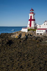 Fishing Boat Approaches Head Harbor Light a Canadian Lighthouse During Low Tide