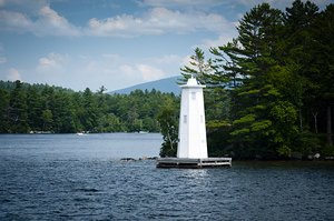 Herrick Cove Light by Rocky Shoreline of Lake Sunapee in New Hampshire