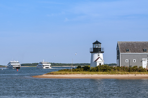Ferries Passing By Hyannis Harbor Lighthouse on Cape Cod in Massachusetts