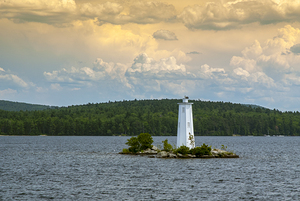 Sunlit Clouds Over Loon Island Light on Lake Sunapee in New Hampshire
