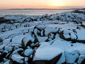 Sunset on Rocky Coast After Snowstorm in Maine
