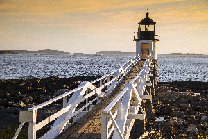 Wooden Walkway to Marshall Point Lighthouse as Sun Sets in Maine