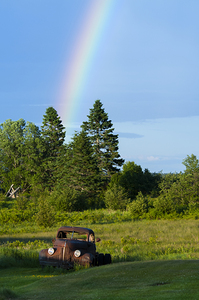 Rainbow by Old Truck in Field in Northern Maine