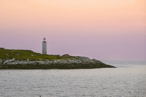 Remote Franklin Island Light Shines Above Rocky Shore in Midcoast Maine
