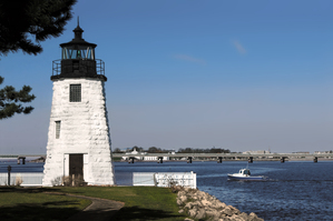 Lobster Boat Passes Newport Harbor Lighthouse in Rhode Island