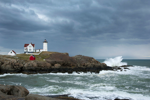 Sunlight Breaking Through Storm Clouds Over Nubble Light in Maine