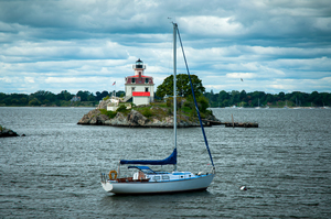 Sailboat Moored by Pomham Rocks Light as Storm Passes in Rhode Island