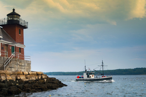 Fishing Trawler Passes Rockland Breakwater Light in Maine