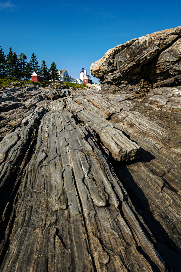 Rock Formations Extend Toward Pemaquid Point Lighthouse in Maine Print