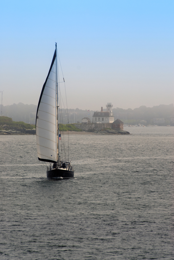 Sailboat Passes Rose Island Lighthouse as Fog Begins to Lift in Rhode Island Print