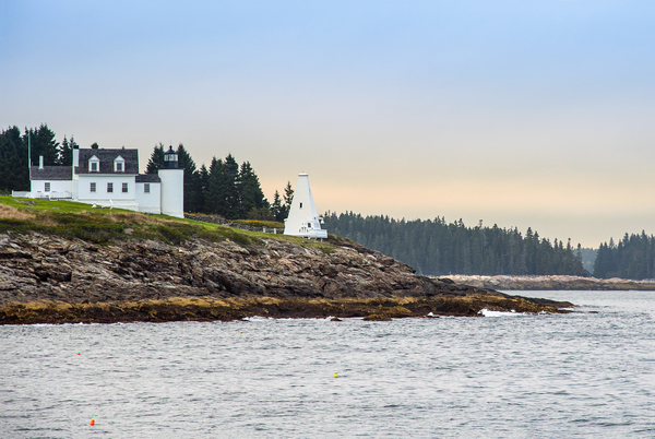 Setting Sun Breaking Through Clouds Over Tenants Harbor Light in Maine Print