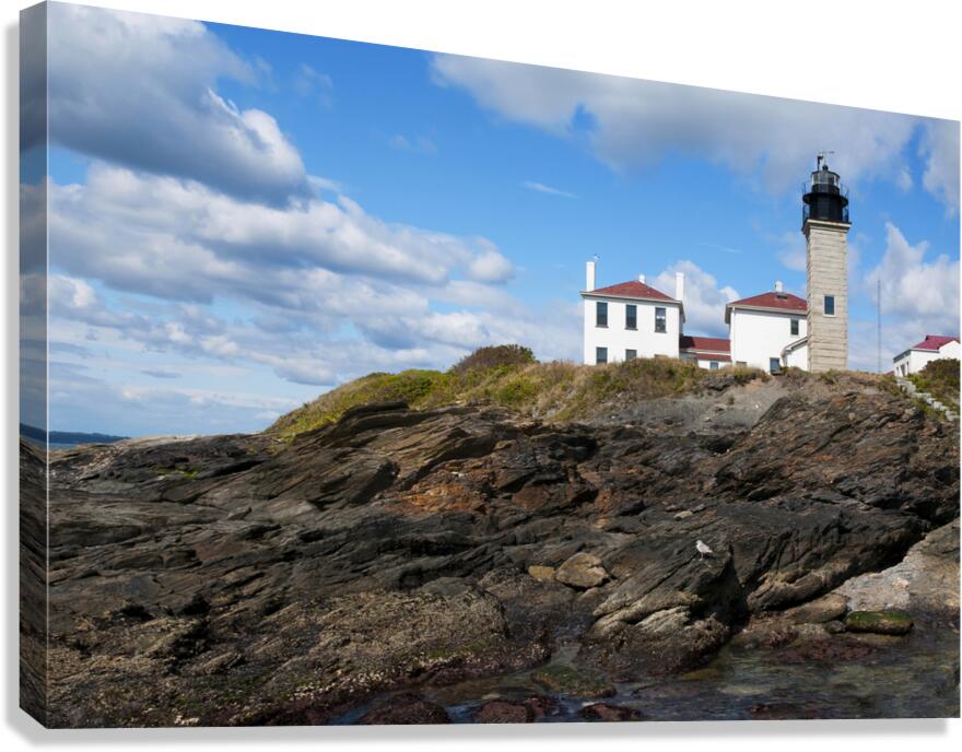 Beavertail Lighthouse Over Dangerous Rocky Shoreline in Rhode Island Canvas Print