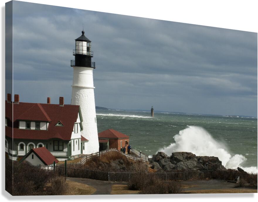 Waves Crash By Portland Head Lighthouse as Sun Breaks Through Clouds Canvas Print