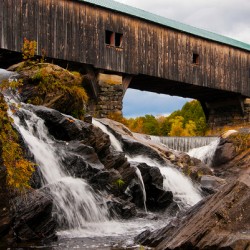 Cascading Waterfalls Under Old Covered Bridge in New Hampshire in Autumn