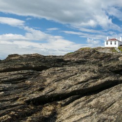 Beavertail Lighthouse Over Unique Rock Formations
