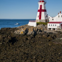 Fishing Boat Approaches Head Harbor Light a Canadian Lighthouse During Low Tide
