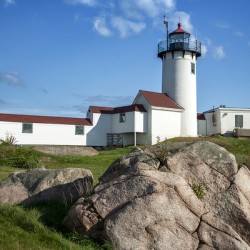 Boulder Shaped Like Wave in Front of Eastern Point Lighthouse in Massachusetts