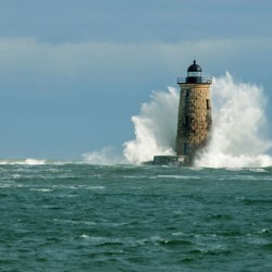 Perfect Crown Wave Surrounds Whaleback Lighthouse Tower in Maine
