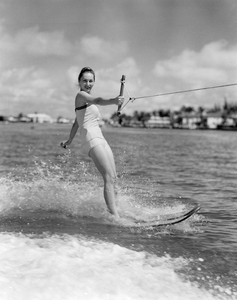 1950s SMILING WOMAN WATER SKIING LOOKING AT CAMERA 176516