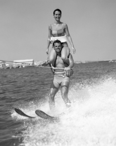 1960s MAN WATER SKIING WITH WOMAN ON SHOULDERS 176532