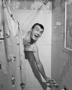 1950s MAN IN SHOWER PULLING SHOWER CURTAIN CLOSED 177043